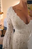 I chose this gorgeous Bohemian dress for my wedding day. The sleeves are just perfect. 
 I probably tried on 10 different Lulu dresses and this was my last and final one before I was going to give up.
Large chested girls be a little mindful there is no give in this dress.  A large would have been way too big on me and a small would have been way too small.  The medium fits perfect but it is a little snug on my chest area. I'm definitely not wearing a bra with this dress and I will be okay. I'm 5'4 so the dress is long on me but I'm not going to hem it. 
It has a beautiful long train I am going to get a bustle put on it. It's worth every penny, a gorgeous dress for every hippie spirited girl. - Sarah B.