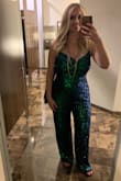 This jumpsuit is a little larger fit for juniors sizing. I'm usually a women's size medium and this medium fit well. I'm 5'6 and wore with flats and it just skimmed the floor. It's bluish green but depending on the light can look either color, mostly green. I wore a strapless bra with it. - Juliyana F.