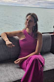 I got this jumpsuit for a fall wedding that was on a boat. Knowing the weather would be windy and chilly, this was the perfect solution to staying warm and not risking a breeze blowing a dress up. The material is thick and the color is beautiful. I am typically a small in most clothing brands but I required a medium in this. I did purchase a small and a medium to try both on. The small did fit but was form-fitting. The medium gave a looser, more comfortable fit. - Melanie S.