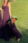 I wore this dress to my friend's wedding as a bridesmaid. I had to hem the dress because I am under 5'3", but it looked great on me. The delicate fabric wasn't hard to iron, it just needed a little bit. The high slit was flattering and not too high. The price was wonderful! Thank you! - Esther R.