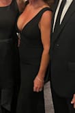 I'm 55 and physically fit. I wore this dress to a formal wedding and it fit perfectly, although I had to get it hemmed just a tad. I felt glamorous in the dress. It is a bit low cut but designed to be that way. If you're uncomfortable showing off your breasts just a tad, this dress may not be for you. I love it! - Ginny W.