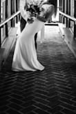 I got married during covid so my actual wedding gown wasn't altered yet. I bought this dress in its place and I absolutely loved it. Was a little long for me and the torso area was a little tight. Very pretty overall and I love the bow on the back. - Ashley K.