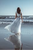 I usually wear small, so I ordered size S, but ended up exchanging it for XS. I wore it for a wedding photoshoot at the beach. It's comfortable and photographs great! The skirt is a bit long for me, but that's usually the case. Had to ask for help to close the top, so have a friend/partner on standby to zip you up ;) - Bianca M.