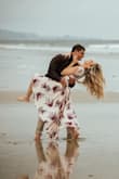 Like many others, I ordered this for an engagement photo shoot. I LOVED it! It is beautiful and has great movement. My photographer really liked it too.  I am typically a size S in Lulus but for this dress, I had to size down to an XS. The XS wasn't tight at all - even with the VS Bombshell push-up bra. You may need to use fashion tape to keep the neckline in place but that's no big deal. I would absolutely rewear this dress for other occasions as well. Highly recommend! - Kara D.