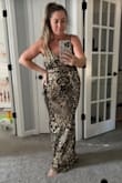 I purchased this for a ball and its AMAZING. So flattering and comfortable. It fits like a
Glove. Zipper enclosure but also a tiny bit of stretch. 10/10! - Andrea W.