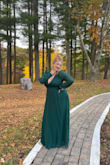 I bought this dress for a fall wedding. I was nervous about the girls falling out, so I used a bit of boob tape for extra security but honestly now having worn it, I don't think I needed it! I got soooo many compliments in this dress, I felt like I really stood out as a wedding guest. I didn't have to get it hemmed because I'm on the taller side and wore heels, but it does come long so prepare to get it hemmed if you're on the shorter side. Only downside is the button at the top in the back came off as I took the dress out of the package. Luckily my best friend can sew so she fixed it for me, however for the price it shouldn't have happened in the first place. Otherwise, a really lovely dress that I think would look nice on a lot of body types! - Kristen K.