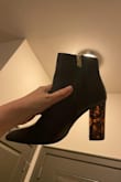 I love these! They look better than I expected. You can only see the color in the light and they look like Amber Gemstones. But otherwise like regular nice black heels. - Dahlia K.