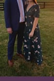 I wore this dress to a fall wedding and it was perfect! I got a small but think I would've a tad more comfy in a medium (but never tried that size). I was surprised at how versatile the length was for me - I am 5'7 and wore it with 3 inch heels and then later switched to flats and it was still the perfect length. It is a very pretty teal color. I love that it came with a snap at the v neck though I double secured with a safety pin. I cant wait to wear it again! - Kayla S.