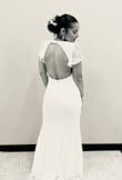 I wore this for my courthouse wedding, I received so many compliments!!!!! People asked if I bought it at a luxury boutique and were shocked when I told them no! Its very flattering for pear shaped bodies and girls like me with smaller chests. I was hesitant to order a small based off the reviews but the small fit perfectly and medium would have been to big! The slit in the front does come a little high so be mindful when you constantly have to sit and stand back up. Other than making small adjustments throughout the day, I absolutely loved this and felt so beautiful wearing it. HIGHLY RECOMMEND - Elisa J.