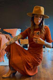 I ended up sending the MEDIUM back once the SMALL got restocked. The color is absolutely stunning. It's super rich and totally the burnt orange I was hoping it would be. I wore it to an October evening wedding. I totally recommend it. - Courtney M.