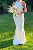 We decided to get our wedding in one week. I bought 6 dresses (this and other pages) but really LOVED this. I had a lot of compliments. It's very elegant. I didn't want the typical big wedding dress that's why I loved this. I wanted to feel comfortable, elegant but also sexy lol and this dress did it! It's much better in real life than in photos. Also I have a lot of problems with the length because am too short but this one was perfect. - Ana R.