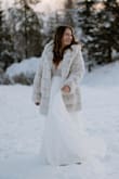 This dress is heavier than it looks - which was actually great at our outdoor December wedding in Alaska! I was able to wear leggings under the dress and no one knew, and the thick fabric kept me warmer than I though! - Brittany R.