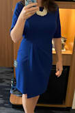 I felt great and got many compliments wearing this dress to a family wedding. The bright blue is fun without being over the top. The size chart suggested a Medium, but I had to size up to a Large which wasn't great for my ego. I usually wear a 6 and the Medium made me feel packed in like a sausage. The dress has a liner to help with any bumps and lumps. I wish the top layer was more wrinkle-free; I tried leaving it in the bathroom during showers but had to pull out the iron. - Julie F.