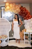 I wore this dress for my bridal shower and thought it was so cute! I'm 5'3" 145lbs & the medium fit perfectly. I did find that it was a bit see-through, so I wore a nude-colored slip underneath and the problem was solved. - NANCY O.