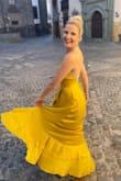 This dress is truly stunning in person. The fabric shimmers and it is so comfortable to wear. I bought it for my honeymoon and spent the day walking around a city. I felt gorgeous and comfortable in it the whole time! I actually also bought it in white for my rehearsal dinner for my wedding too because I loved it so much. One of my favorite dresses! - Carolyn B.