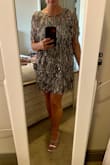 Although some reviews said this dress runs short, I found it to be a normal length for my 5'3" frame, hitting mid- thigh. When I first took it out of the box I wasn't too sure but when I put it on it's gorgeous and so sparky. It's also COMFORTABLE. I wore this to my sister's wedding and it was perfect for dancing. - Alexandria H.