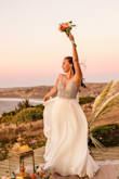 I really loved my dress. It was comfortable and more beautiful than I expected. I had to adjust a little the length and straps. I live in Chile so I brought it with a shipping company. All perfect for my elopement wedding - Fabiana H.