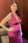 I ordered a large and it fit everywhere but was a little big in the bust so I did have the halter taken in. I probably could've worn a medium but I didn't want it to tight in the abdomen. This dress was gorgeous and quality material. My co-worker bought one after she saw mine! - Danielle L.