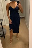 I cannot recommend this dress enough! It felt amazing the entire night. I was concerned when I ordered it because midi dresses don't usually look great on me with large calves and wide ankles but wow! The curved bottom made me feel so feminine.
I also was worried about the straps being too weak but they held all night long. The top was too tight to wear with a bra but I just put nip covers on and felt secure all night even with lots of dancing and jumping.
Warning! The slit does do all the way up. Have safety pins on hand if you plan to sit, dance, or move in this dress if you don't want people to get a peek of your downstairs secrets.
All in all though, once I secured the bottom to a comfortable closure, it was the best thing I could've asked for for this fall wedding! - Jennifer B.