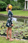 I wore this dress to an engagement party, and I received lots of compliments. Love the color, pattern, and material! It is a wrap style, and I wish there was just a bit more fabric to wrap around me - it was a tad small around my ribs and I had to pull it pretty tight to make sure my chest wasn't popping out. I was definitely keeping an eye on my chest throughout the night to make sure it wasn't getting inappropriate. I am usually a S or sometimes an XS in Lulus, so that was a little surprising. That being said, I love the dress and will definitely wear again! - Olivia W.