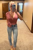 With having a larger bust I wasn't sure if this top would fit but I love it! It's definitely revealing without a cami but everything stays in place. Cute casual and sexy at the same time. - Sara Y.