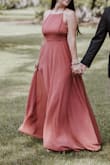 I ordered this dress to wear for my engagement photos, and it was lovely! I'm about 5'5 and 145lbs, and the Medium was a little too large, especially in the chest and length. Otherwise, it flowed great in the pictures and looked beautiful! - Kelsey D.