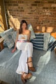 It was the perfect find for my bridal shower. Strapless but comfortable and it stayed in place. I could not avoid panty lines without buying shape wear but it all worked out! It is rather long and I may get it hemmed but worked with heels. Would recommend ! - Jasmine R.