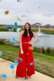 It's a fun jumpsuit and the wide leg pants have slits so it looks like a cape or a dress style. - Ashley P.