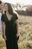 I ordered both a S and M to evaluate the fit for my engagement photos. While both fit okay, the small definitely had a LOT more boob exposure which I wasn't looking for, so I kept the medium. I will say the smaller size (if you're smaller chested) fit my waist and hips better. - Megan S.
