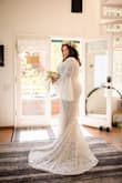 I was getting sad about not finding a dress for my elopement... then I came across Lulus on Instagram. I went with my intuition and ordered this dress and it felt so right! Gorgeous ivory color, soft and cool lining, and perfect length, I don't even have to wear a bra, it makes me look good :) Plus, it can be worn with different accessories (I have 3 different wedding events and will wear it in each one with different accessories: flower crown and blush-colored heels, a chiffon bow and cognac leather boots, and a Spanish comb and flowers/veil over comb, respectively). No regrets :) - Andrea I.