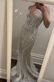 This dress is everything and more! From other reviews, it looked like it ran a little large so I ordered an XS even though I usually fit in a Small. I don't really have any curves so I love the illusion it gives with the beading. It's so beautifully done, you would think I'd spent what most people do on a wedding dress! It really did fit perfectly, I'll only need to have it hemmed! - Taylor C.