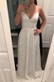 I truly love everything about this dress. It made me feel beautiful and comfortable as soon as I put it on. The cut is super flattering. The straps are adjustable. The satin intermixed with the floral pattern is so subtle and pretty. I returned it because I am looking for a wedding dress that is a bit more fancy than this, but if I had to wear this dress on my wedding day I wouldnt be complaining! - Claire G.