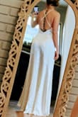 This is such an exquisite gown and quality material. It hugs my curves in all the right ways and makes me feel so elegant and graceful. The high low feature provides the same timeless feel as having a train without the hassle of having to dance around it or bustle. I would highly recommend this dress for any occasion and am so excited to wear it on my wedding day. - Kylie W.