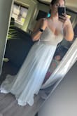 Everything about it I love! Especially the open back. I bought i size 10 and it's true to size. This will be my reception dress. - Crystal V.