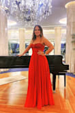This dress fit great! The material falls so beautifully and the fit was perfect. The color is not the red in the picture, it's more of a burgundy red. It's very long, but I wore it with cream platform sandals and did not have to fix the hem. I wore this to a wedding and it was a hit! - Emely C.
