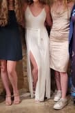 This is made of heavy, soft tshirt material that weighs the dress down and causes it to fall down your body. I tightened the straps as far as it could go and the weight still pulled it down almost exposing the ladies. It was really annoying to deal with this at my rehearsal dinner but look at how cute the photos turned out. It looked great but was a constant annoyance. Would not buy it again. - Jenna H.