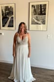I bought this as my wedding dress for a small beach wedding and absolutely love it.  I purchased the size 10 and will likely need to get the back altered a bit (or ya know, get in a little bit better shape so it sits well), but it's truly so beautiful!  I thought I would want to get a white inlay to back the mesh on the front - 1 to make it a little classier and because I thought the padding where the cups are wouldn't look great, but I don't think I'll be doing that anymore, even. my mom agreed she loved it as is!  These pics are wearing it with a sticky, backless bra, but I've tried it on without one as well because I was worried about that and it was about the same.  The mirrored picture shows it a little more fitted on the top, my mom is crouching behind me holding the straps. - Crystal T.