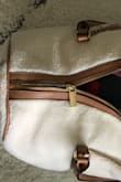 I bought this months ago because it was so cute. Just used it for the first time for a weekend trip in October. First use, the zipper broke. No, my bag was not overstuffed (which was a feat because this doesn't actually hold that much). No, I wasn't rough with it. - Tieisha T.