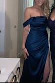 The dark teal color was so pretty! The dress fits true to size. Very soft and comfy. I didn't wear a bra with it (only pasties) and it stayed up all night. The slit is a bit high but still covers everything! The dress is a tad long even with 4inch heels and since I didn't have time to get it tailored, I kept tripping over the front. Lol I didn't get a full length pic but here's half length. - Charlene E.