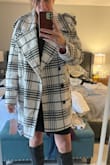 I initially ordered a large but when I tried it on I was swimming in it. It's a boxy cut so it's not super flattering but I loved the pattern and the pop of pink inside!!!! So I exchanged it for a medium. I'm tall and about 160# for reference. Def size down. - JESSICA W.