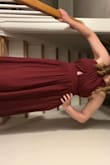 I think the dress is true to size, but I am short and it was way long. However, buying this and paying for it to be hemmed was still cheaper than other formal attire in stores. I would totally recommend this! - Mackenzie H.