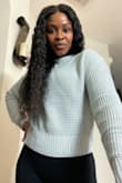Finally, it's sweater weather. I love the fit of the sweater. I will purchase another one in the alternate color. Small was the perfect size for me. There was room in order to layer up under the sweater. This sweater goes perfectly with tights, solid color skirt (with leggings) or jeans. I LOVE this sweater. - KK I.
