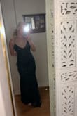 The dress fits perfectly. Little long on the bottom but nothing a pair of heels can't fix! The back is gorgeous and the fabric isn't itchy or thin. - Makenna H.