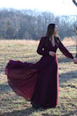I wore this dress for my engagement photos and am in love with how it looked. The wrap style allows the dress to be adjustable for different waists which was great. It was a little big in the bust area, so I did have to tape the dress for a more modest look. My only complaint is that while I was putting the dress on, one of the buttons on the sleeve fell off and needs to be sewn back on. Overall, this dress was everything I wanted and looks magical in the photos! - Katelyn L.