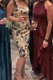 Wore this to an evening wedding. It was a little tight but went with it. The beading was slightly scratchy when your arms rub against it. I got a lot of compliments and felt great. - Erika J.