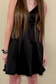 Exactly as pictured and true to size. Cute black satin dress perfect for any evening look. Would definitely recommend this dress. - Stephanie C.