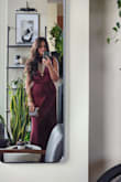 I ordered this dress to wear to a Fall wedding and it was absolutely perfect! I received many compliments on it! The high neck and solid color perfectly complemented the necklace that I wore with it. I did have to wear heels that were about 3.5" high for the dress to not drag on the floor. I would strongly recommend steaming the dress before wearing it as it was pretty creased out of the package and steaming it made it look 50 times better and more expensive. Overall, great purchase!! - Tanvi S.