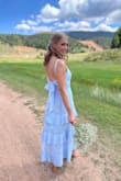 I purchased this dress for my friend's wedding and it was perfect for the event. The material is light for hot weather but not see-through. The fabric details are beautiful and look well-made. The straps are also adjustable which is great. I could even wear a strapless bra and hide it under the bow in the back. My only criticism is there was some gapping on the sides of the bust. It almost felt like it was too loose on the chest but fit fine everywhere else. Otherwise, it was beautiful! - Taylor H.
