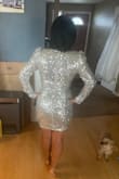 This truly shines! I'm excited to wear this for my bridal shower coming up. Please note that there are padded shoulders and can show cleavage depending on your chest. Overall, very happy with the purchase. It has the nice "wow" factor that I'm going to wear again for NYE! - Mindy N.