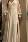 I absolutely can not wait to get married in this dress. It is super good quality and very beautiful! Fits really well, although a little long. The sleeves have little buttons on them and one actually came off when I pulled it out of the bag. I think I am going to end up gluing it. - Autumn G.